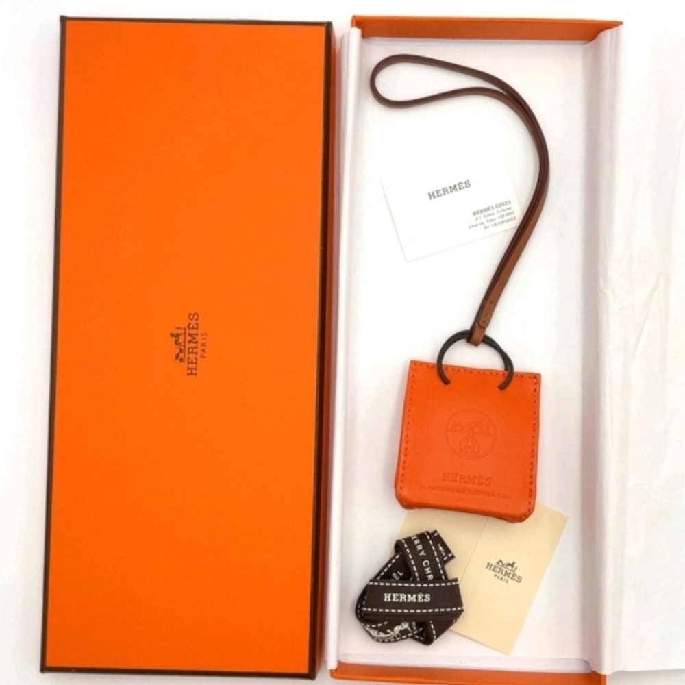 HERMÈS ORANGE LEATHER MINI POUCH BAG CHARM KEY HOLDER + BOX